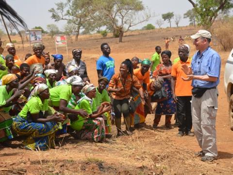 Tony being welcomed by lead farmers and fire volunteers in Yameriga